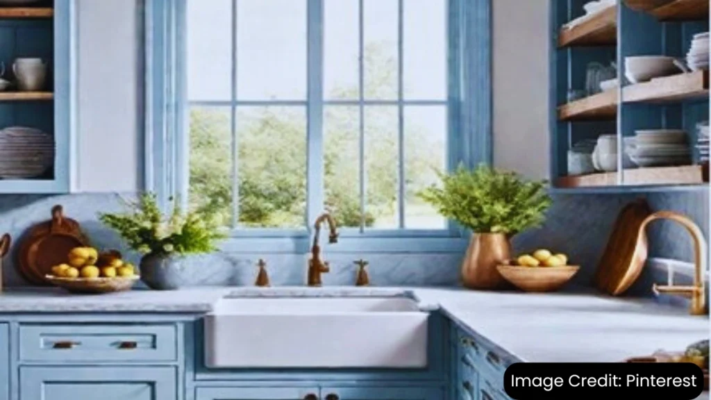 Rustic kitchen with distressed blue cabinets, white countertops, and open shelving.