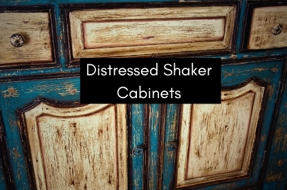 A cabinet adorned with the words "distressed shaker cabinets," exemplifying a classic and worn style in home decor.