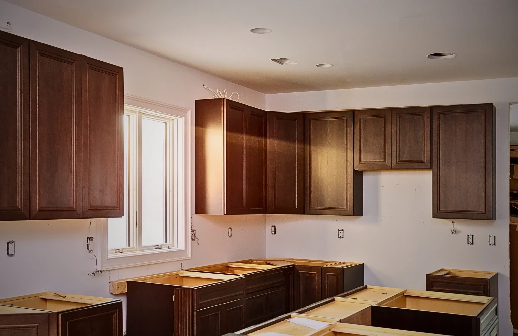 A kitchen featuring unfinished cabinets and countertops, highlighting the potential for future renovations and design improvements.