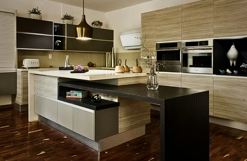 A stylish kitchen showcasing wooden floors and black cabinets raises questions about appropriate cabinet expenditure.