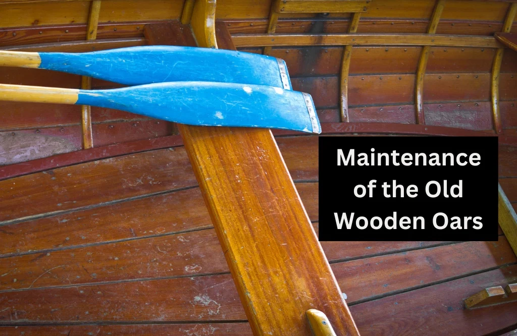 Close-up of a pair of wooden oars on a boat showcasing the significance of maintaining old wooden oars.