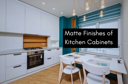 A kitchen featuring matte white cabinets and blue walls, creating a modern and inviting atmosphere.