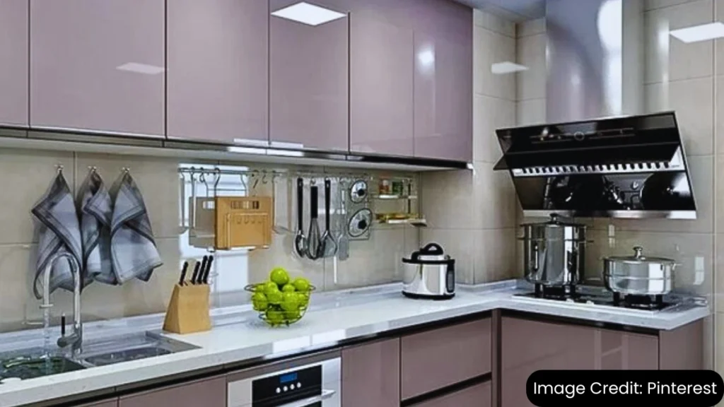 Modern kitchen with modular cabinets in a soft purple shade featuring sleek handles and a spacious layout.