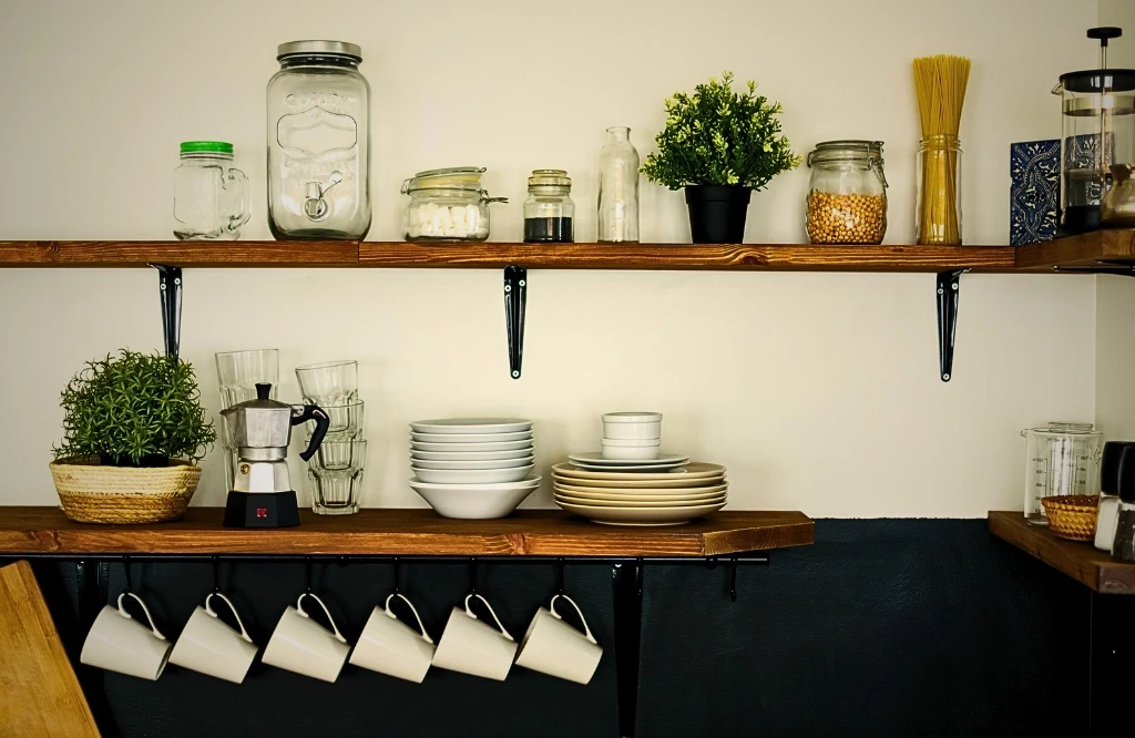 A well-organized kitchen with open shelving, showcasing jars that enhance the aesthetic and practicality of the space.