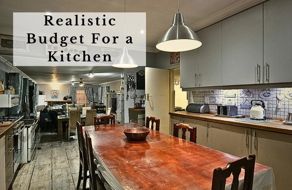 A practical kitchen space with a table and chairs, reflecting a realistic budget approach to home design.