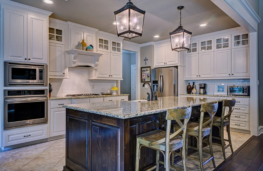 Kitchen with center island and bar stools, showing a cozy eating spot in the kitchen.