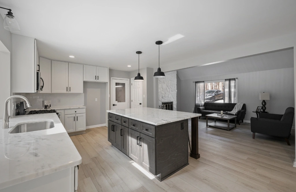 Trends and innovations in cabinet sizes of kitchens are showcased in this image of a modern kitchen with white cabinets and a large island.