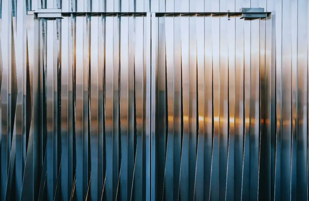 Sleek aluminum panels used for weatherproof outdoor kitchen cabinets, offering durability and style.