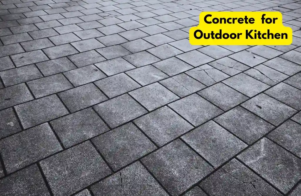 Durable concrete paving for outdoor kitchen flooring.