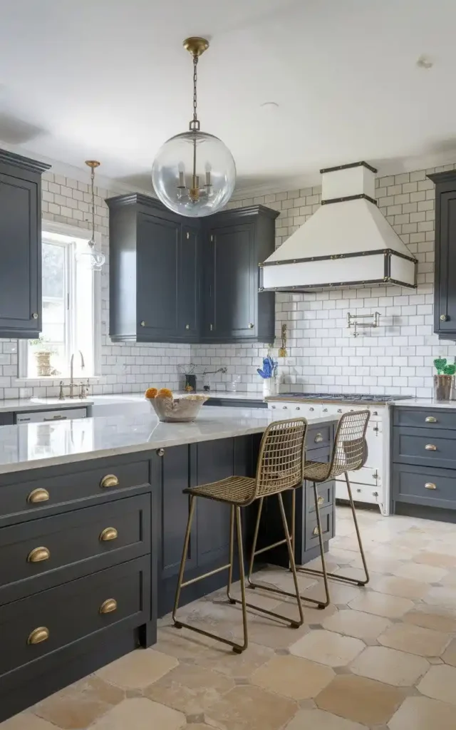 elegant kitchen with grey cabinets and brass hardware