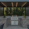 inspiring small covered outdoor kitchen ideas with built-in grill, brick base, and covered seating area