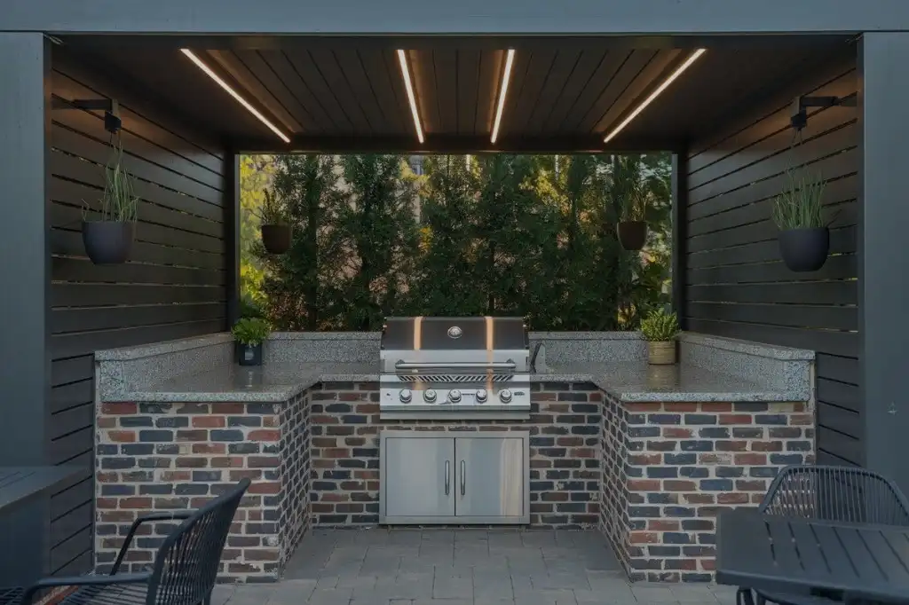 inspiring small covered outdoor kitchen ideas with built-in grill, brick base, and covered seating area