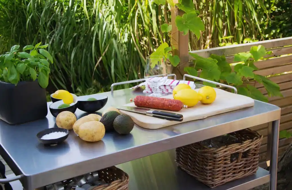 Outdoor kitchen cabinet made of stainless steel, showcasing a sleek and durable surface perfect for food preparation in an outdoor setting.