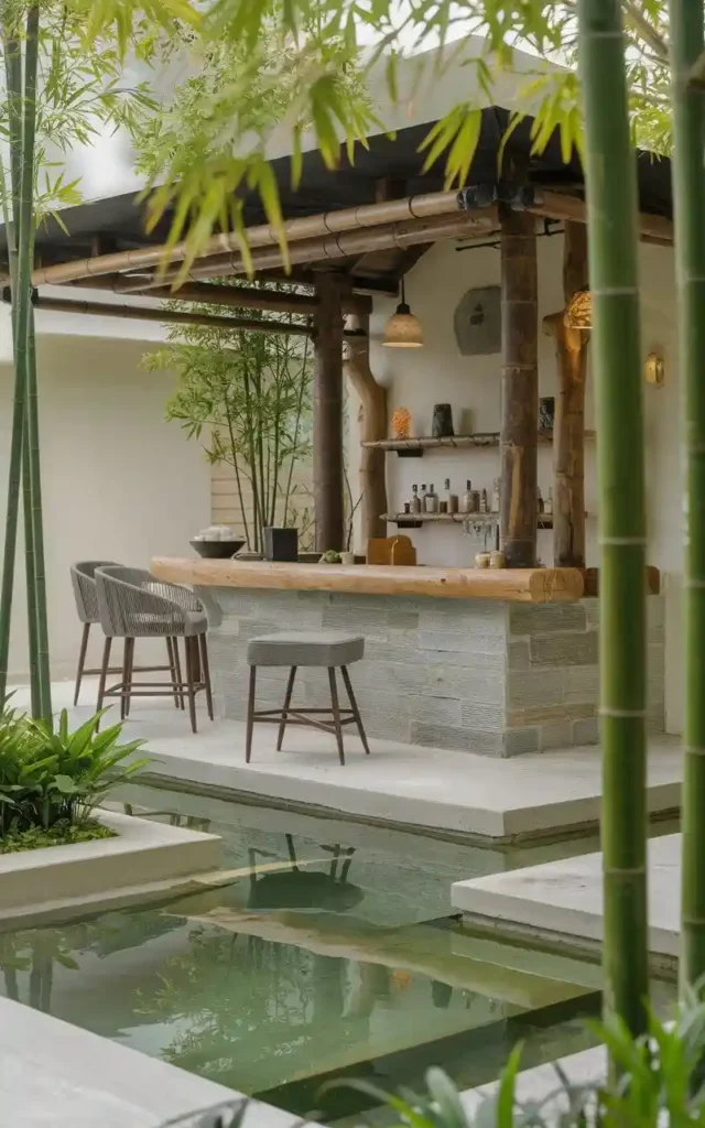 Zen-inspired outdoor bar with bamboo plants, stone counter, and serene water features.