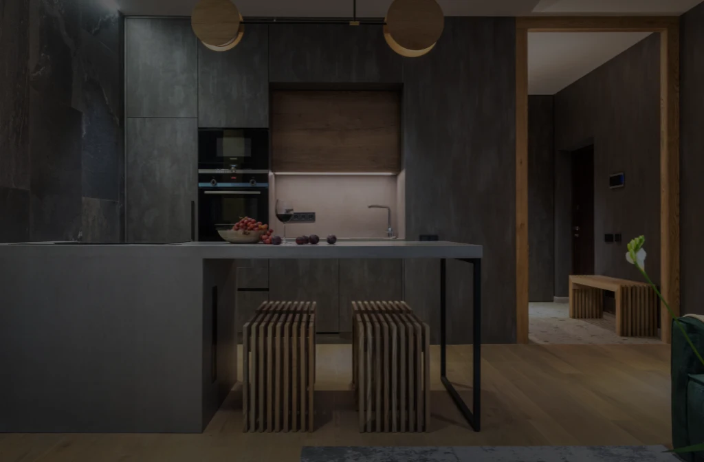 Dark modern kitchen with sleek concrete finishes and wooden accents